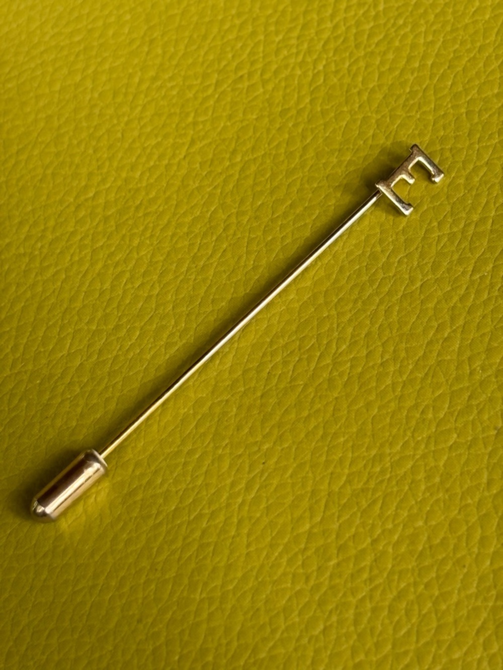 Vintage monogram “E” gold tone hat lapel pin